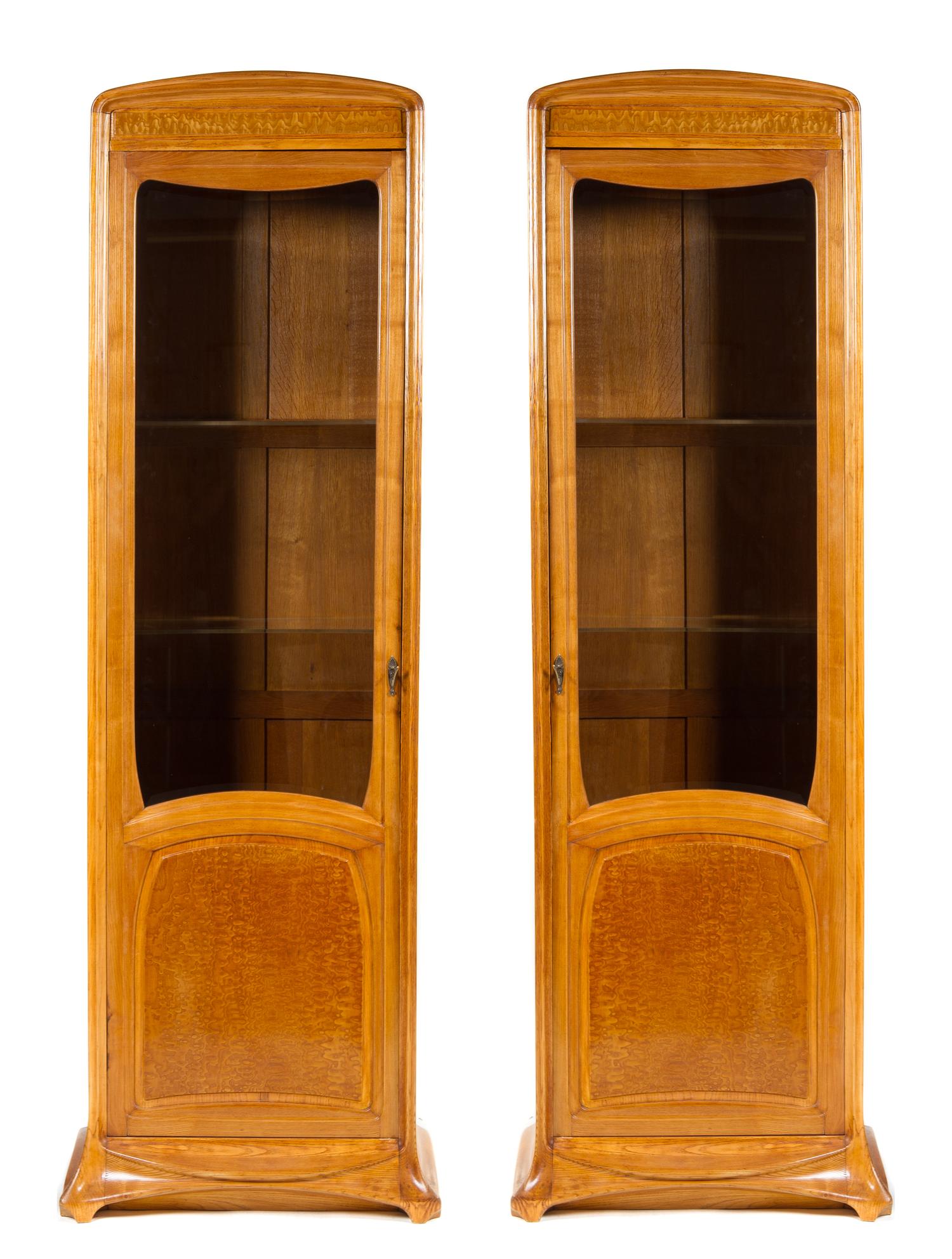 A Pair of French Art Nouveau Oak and Birch Display Cabinets, Louis Majorelle Height 84 x width 25 1/4 x depth 15 1/4 inches.