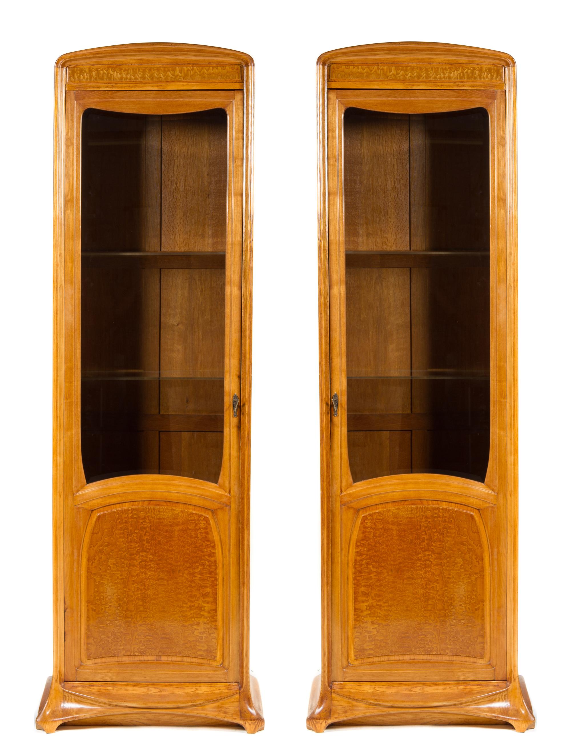A Pair of French Art Nouveau Oak and Birch Display Cabinets, Louis Majorelle Height 84 x width 25 1/4 x depth 15 1/4 inches.