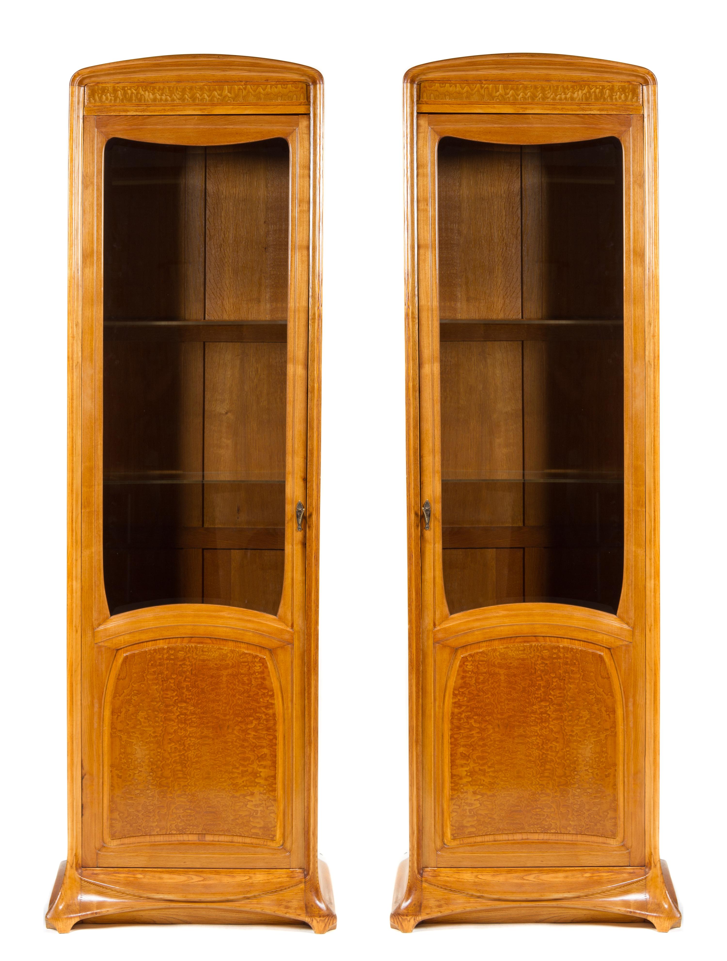 A Pair of French Art Nouveau Oak and Birch Display Cabinets, Louis Majorelle Height 84 x width 25 1/4 x depth 15 1/4 inches.