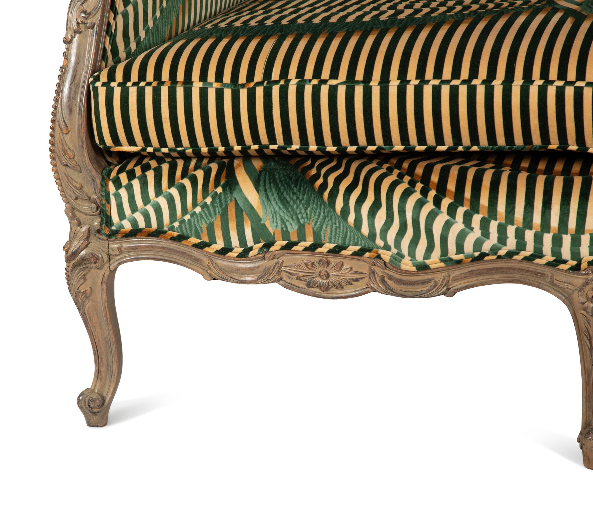 A Louis XV Style Carved and Stained Mahogany Sofa