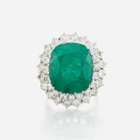 An emerald, diamond and white gold ring