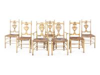 A Set of Seven French Provincial Painted Chairs