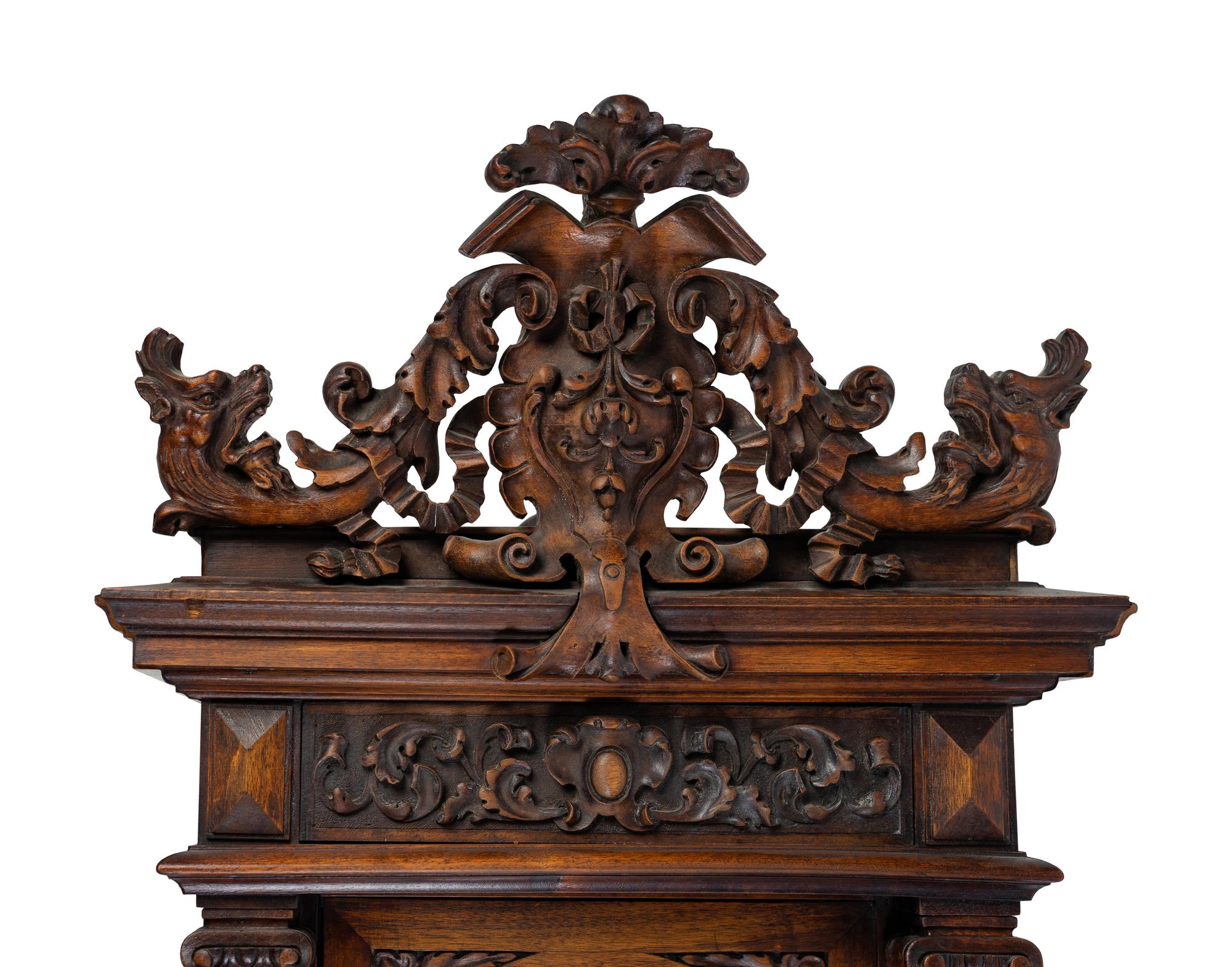 A Renaissance Revival Carved Walnut Regulator Clock