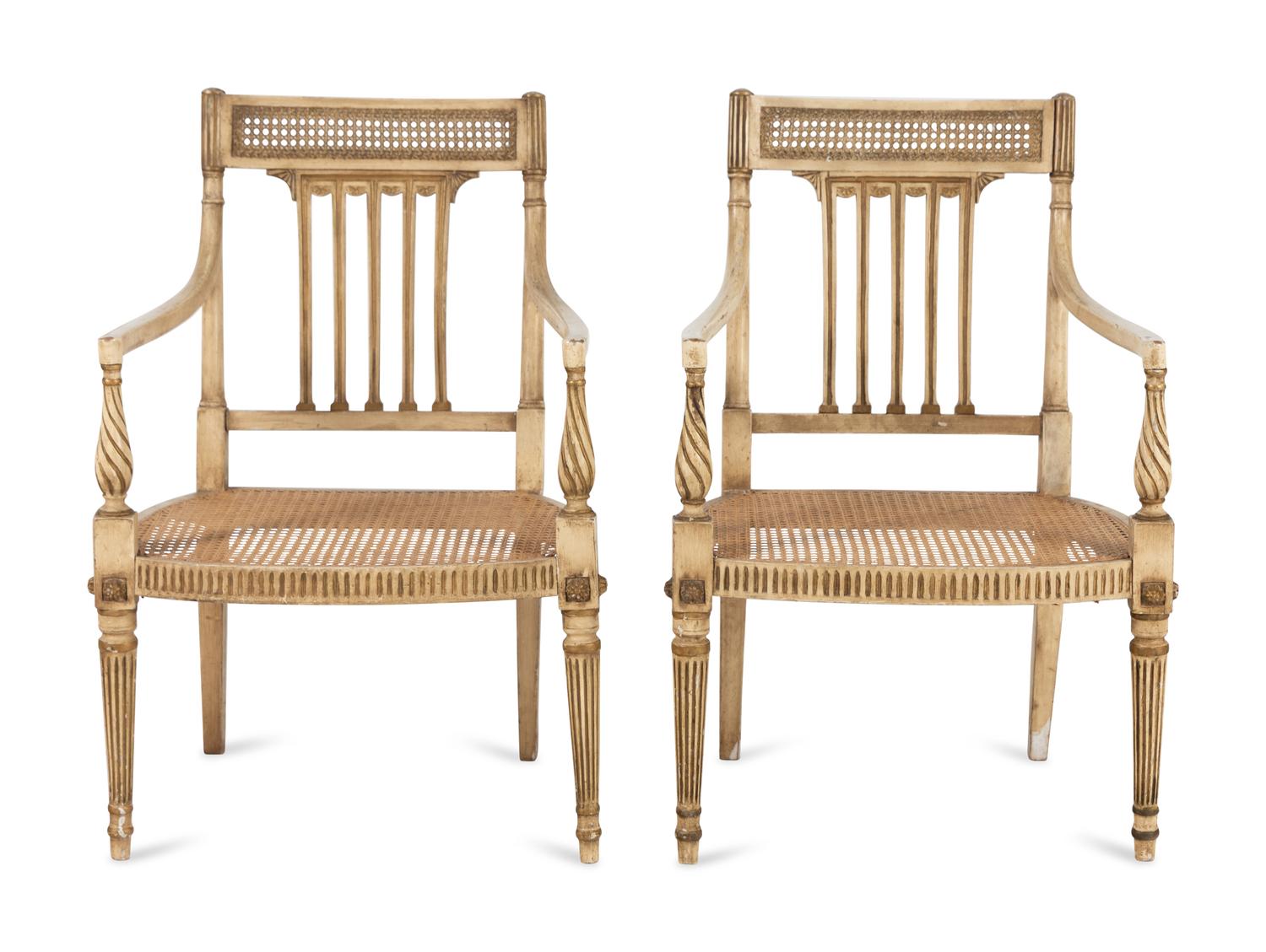 A Pair of Louis XVI Style Crème-Painted and Parcel-Gilt Fauteuils