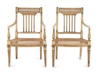 A Pair of Louis XVI Style Crème-Painted and Parcel-Gilt Fauteuils