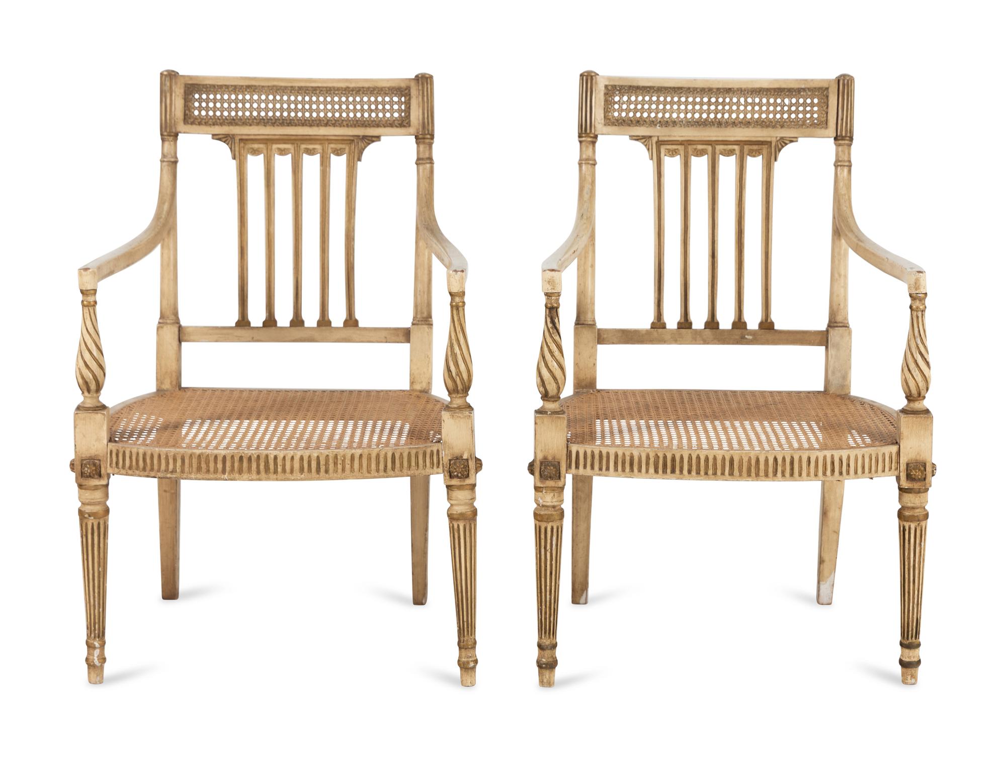 A Pair of Louis XVI Style Crème-Painted and Parcel-Gilt Fauteuils