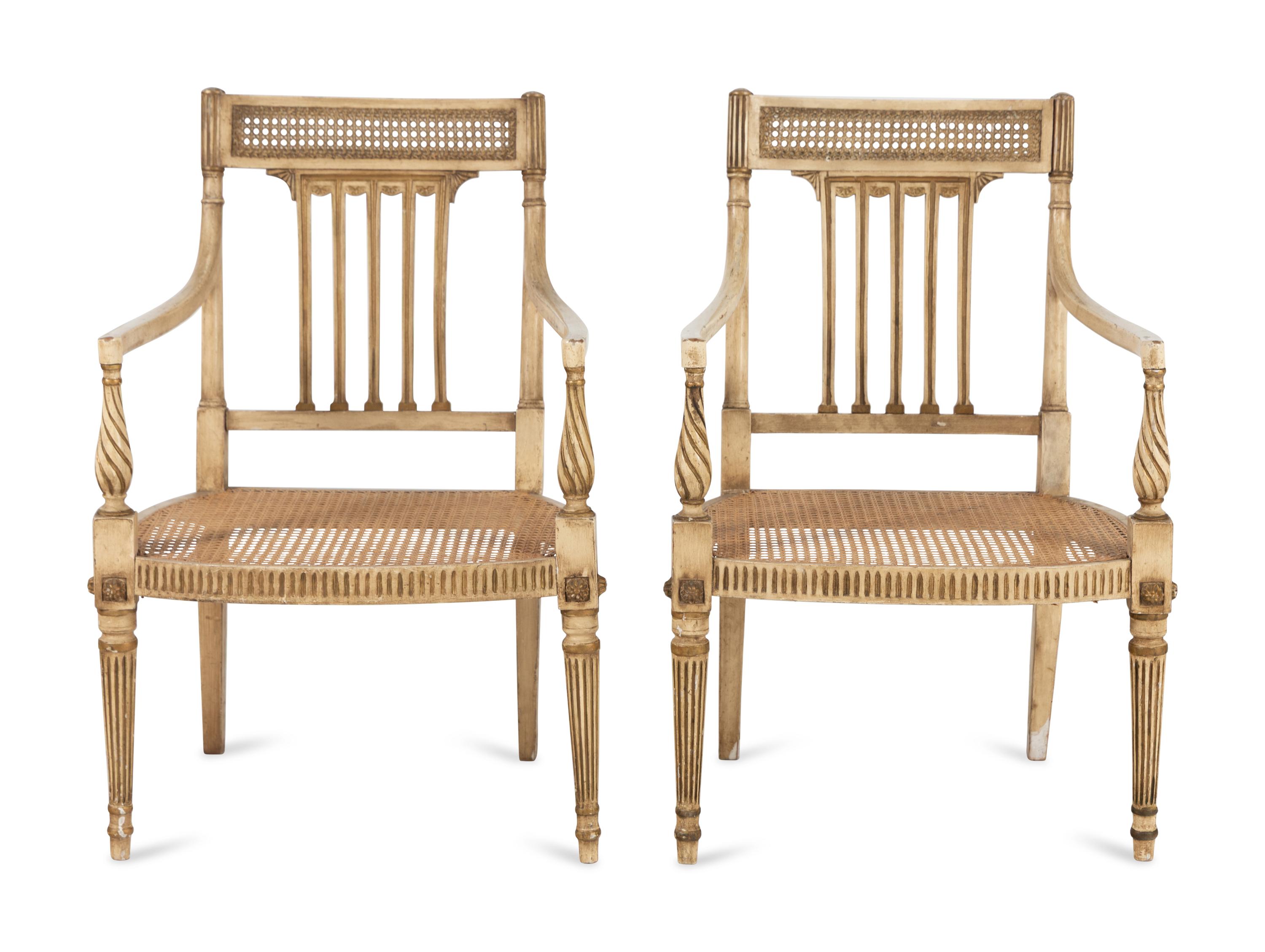 A Pair of Louis XVI Style Crème-Painted and Parcel-Gilt Fauteuils