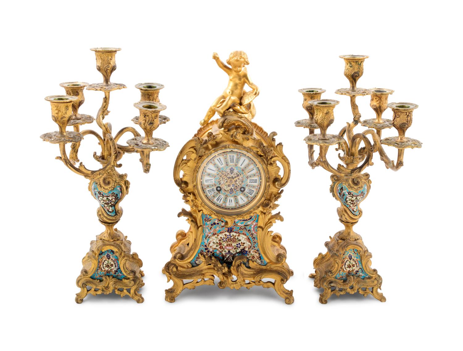 A Louis XV Style Gilt Bronze and Champlevé Enamel Clock Garniture