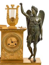 An Empire Gilt and Patinated Bronze Figural Mantel Clock