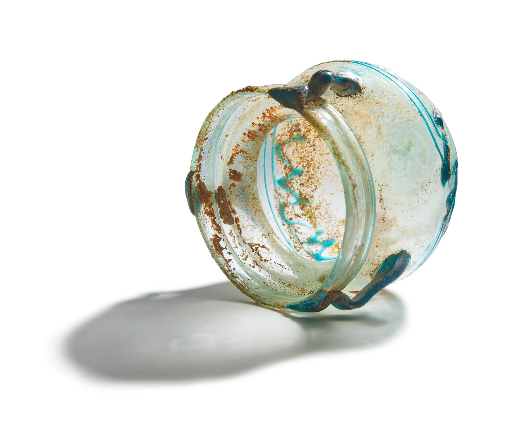 A Roman Pale Blue Glass Jar with Blue Spiral Trail