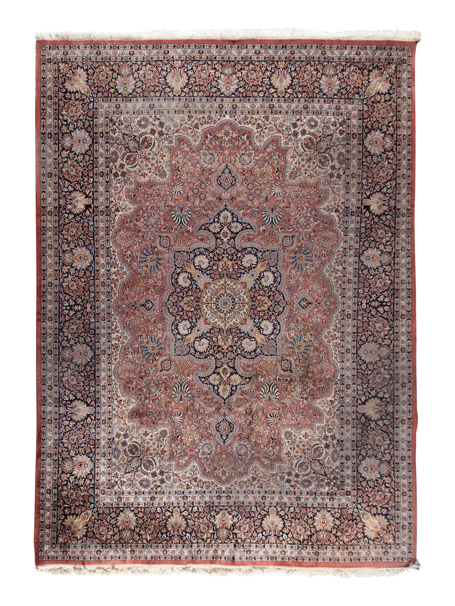 A Qom Wool and Silk Rug