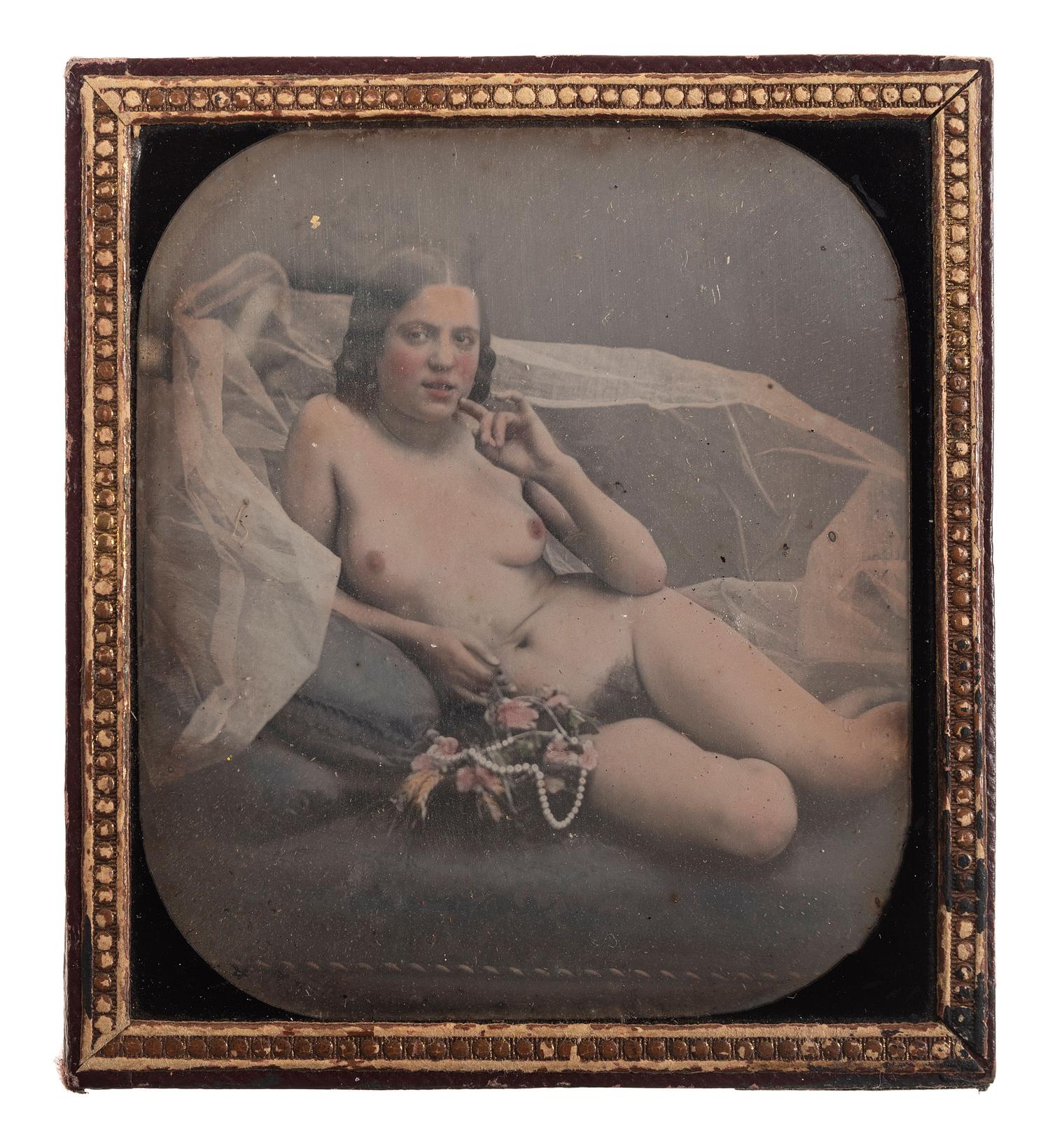 [EARLY PHOTOGRAPHY]. Sixth plate hand-colored daguerreotype of a reclining female nude.