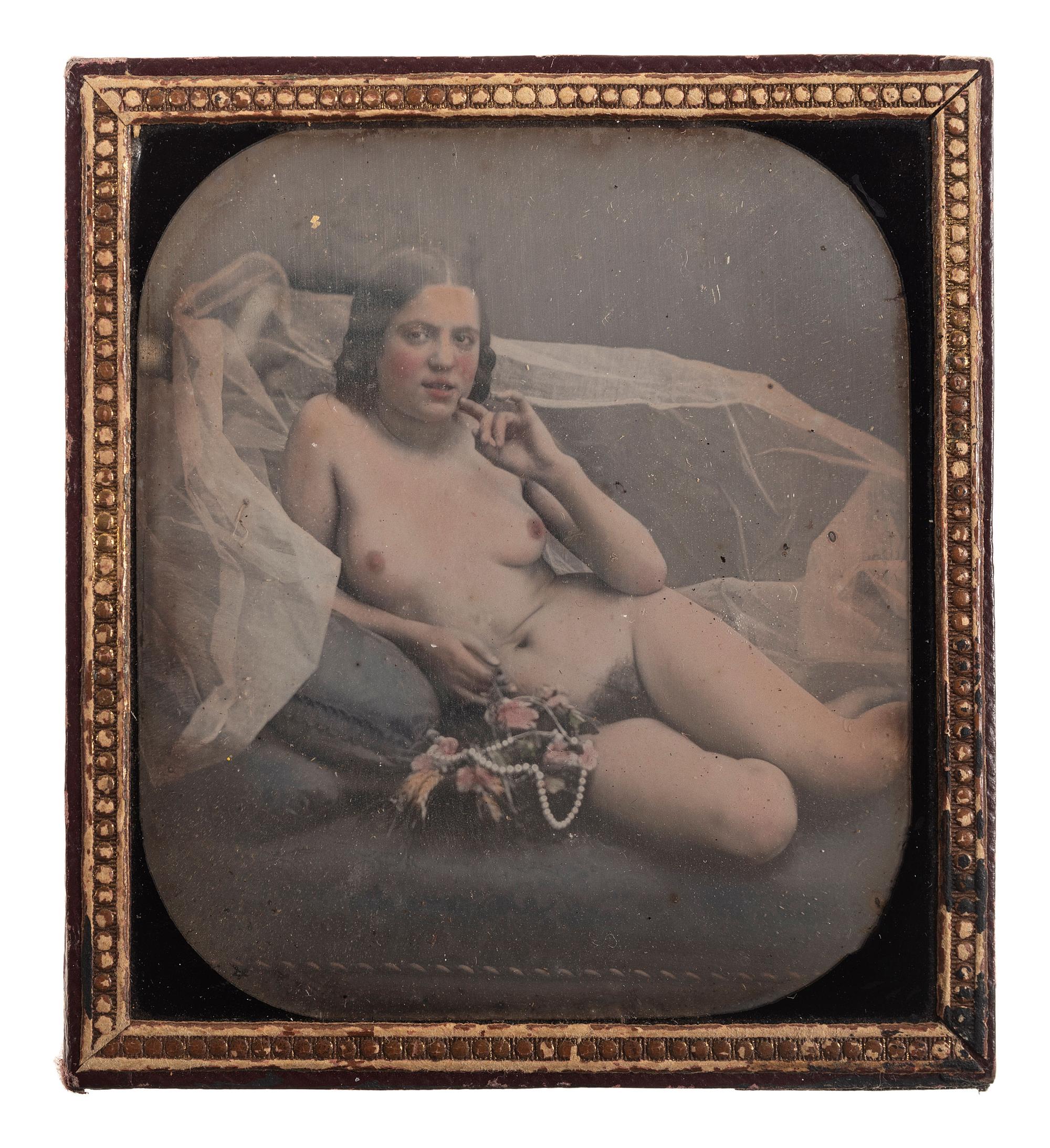 [EARLY PHOTOGRAPHY]. Sixth plate hand-colored daguerreotype of a reclining female nude.