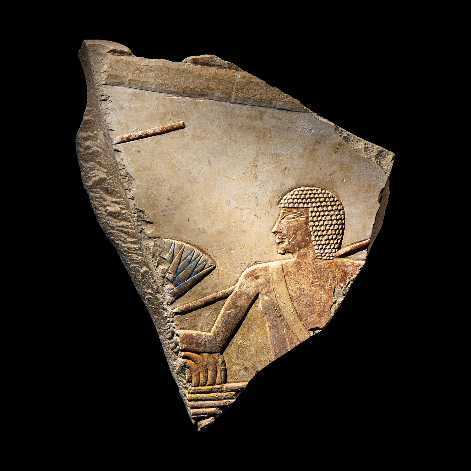An Egyptian Painted Limestone Relief Fragment