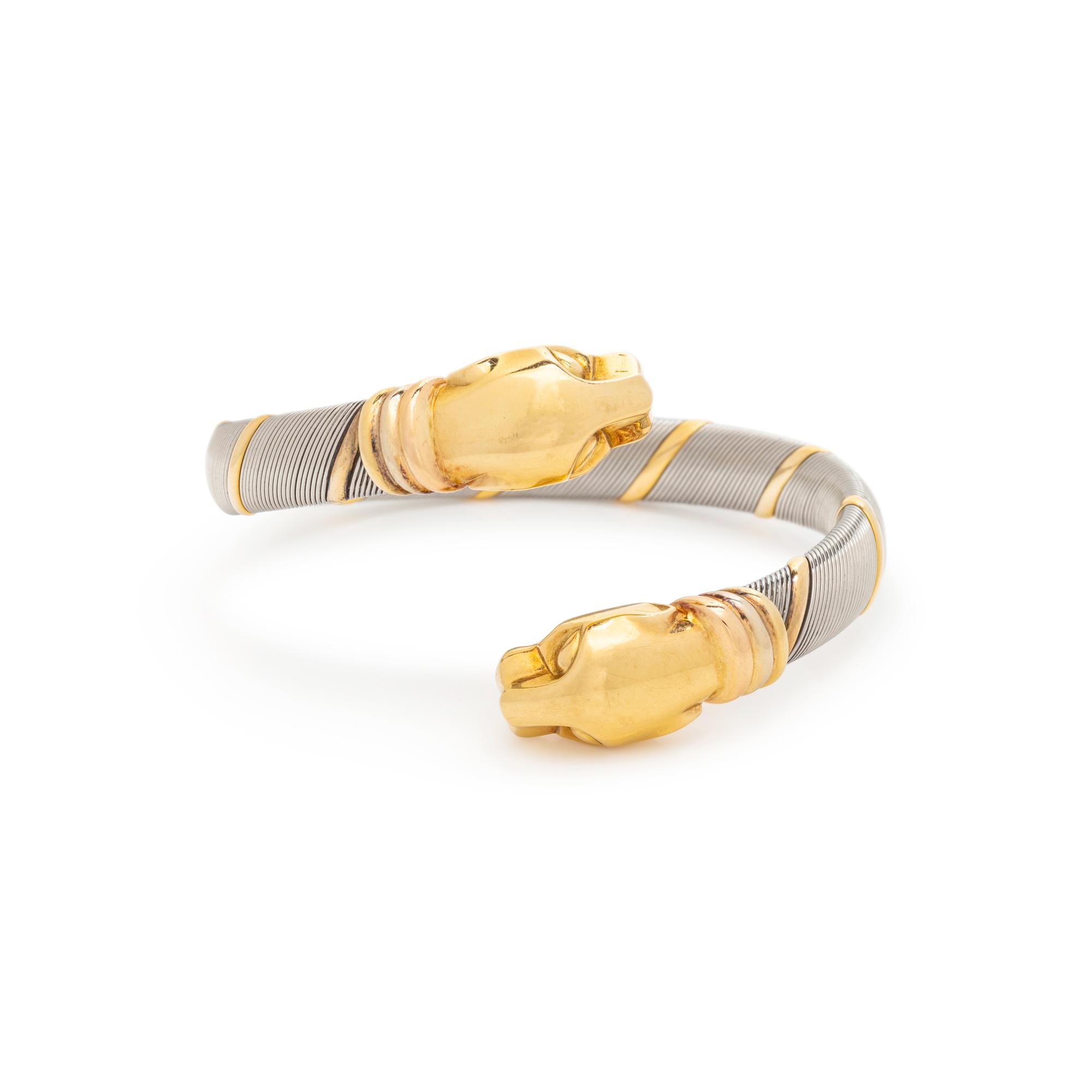 CARTIER, STEEL AND YELLOW GOLD PANTHER BYPASS BANGLE BRACELET
