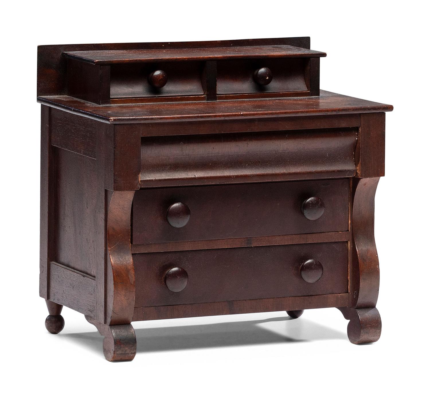A Diminutive American Empire Mahogany Chest of Drawers