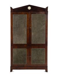 A Regency Style Suede-Inset Mahogany Armoire