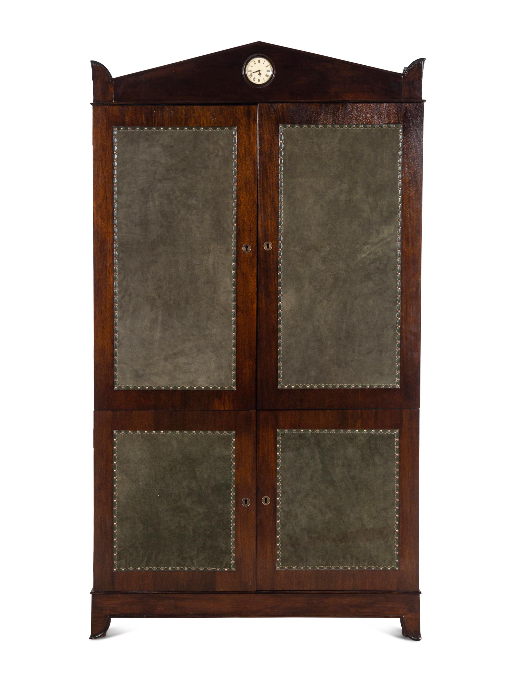 A Regency Style Suede-Inset Mahogany Armoire