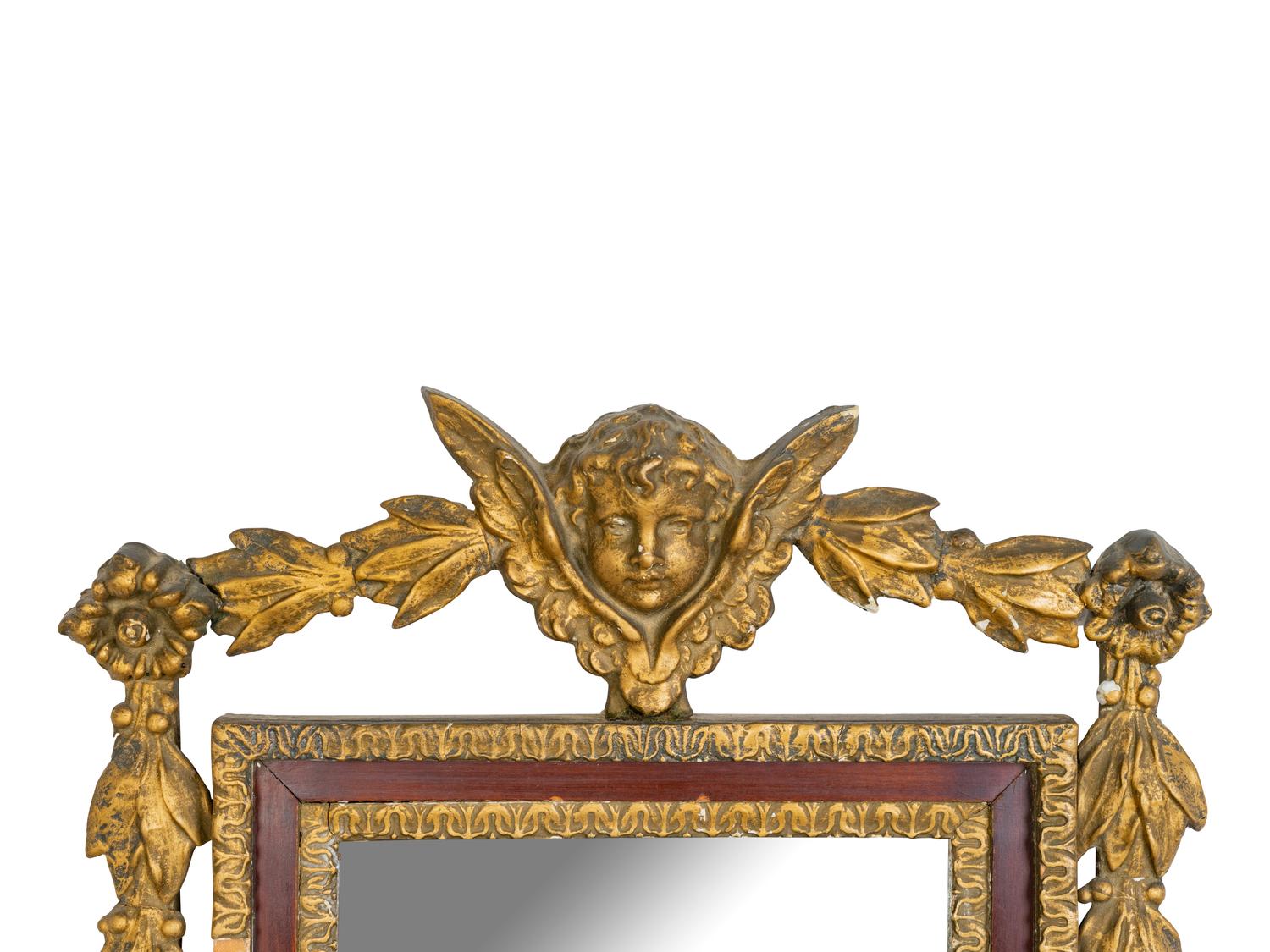 An Italian Baroque Style Giltwood Mirror