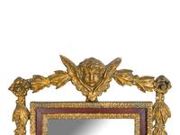 An Italian Baroque Style Giltwood Mirror