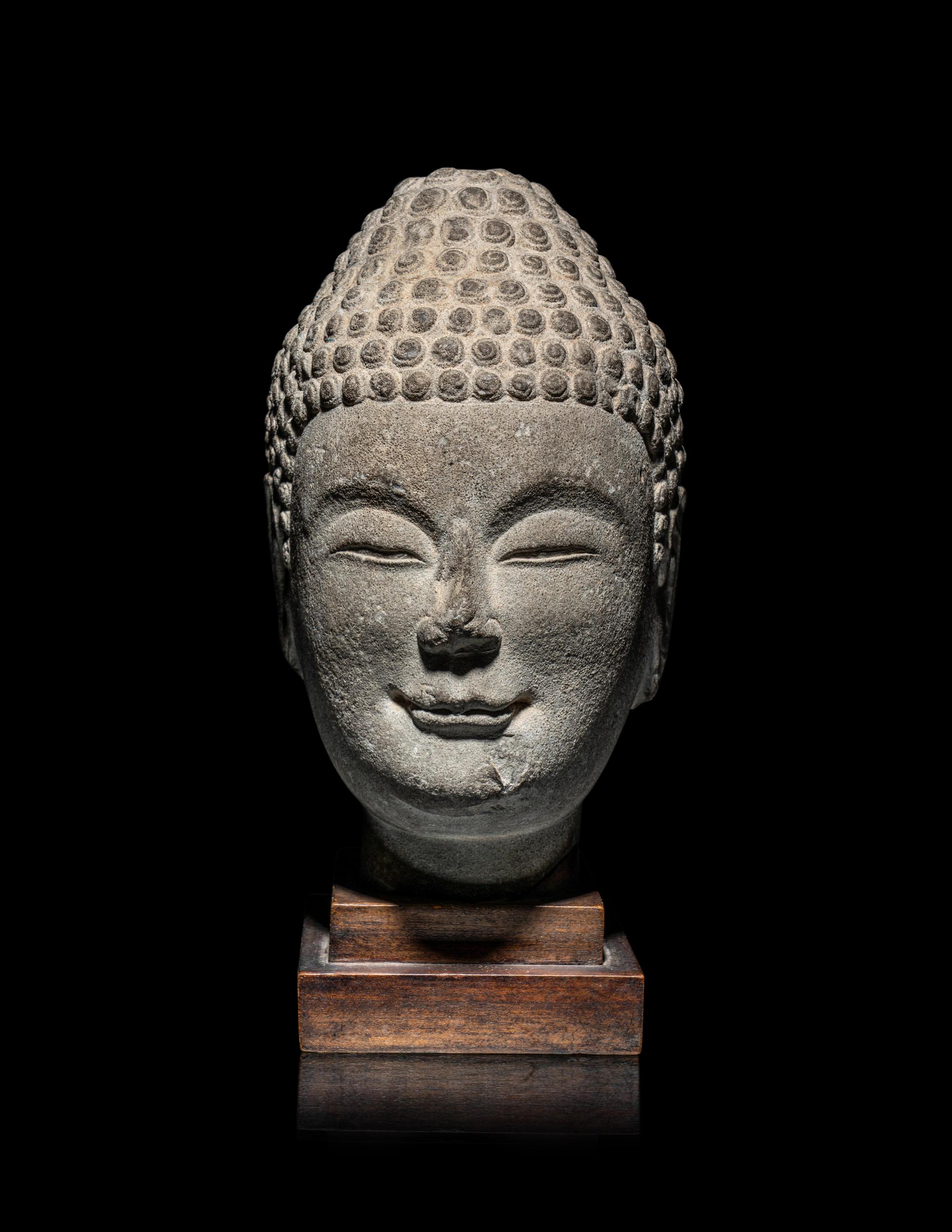 A Chinese Carved Stone Head of Buddha