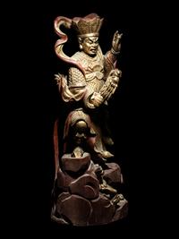 A Set of Four Gilt and Red Lacquered Wood Figures of Guardians