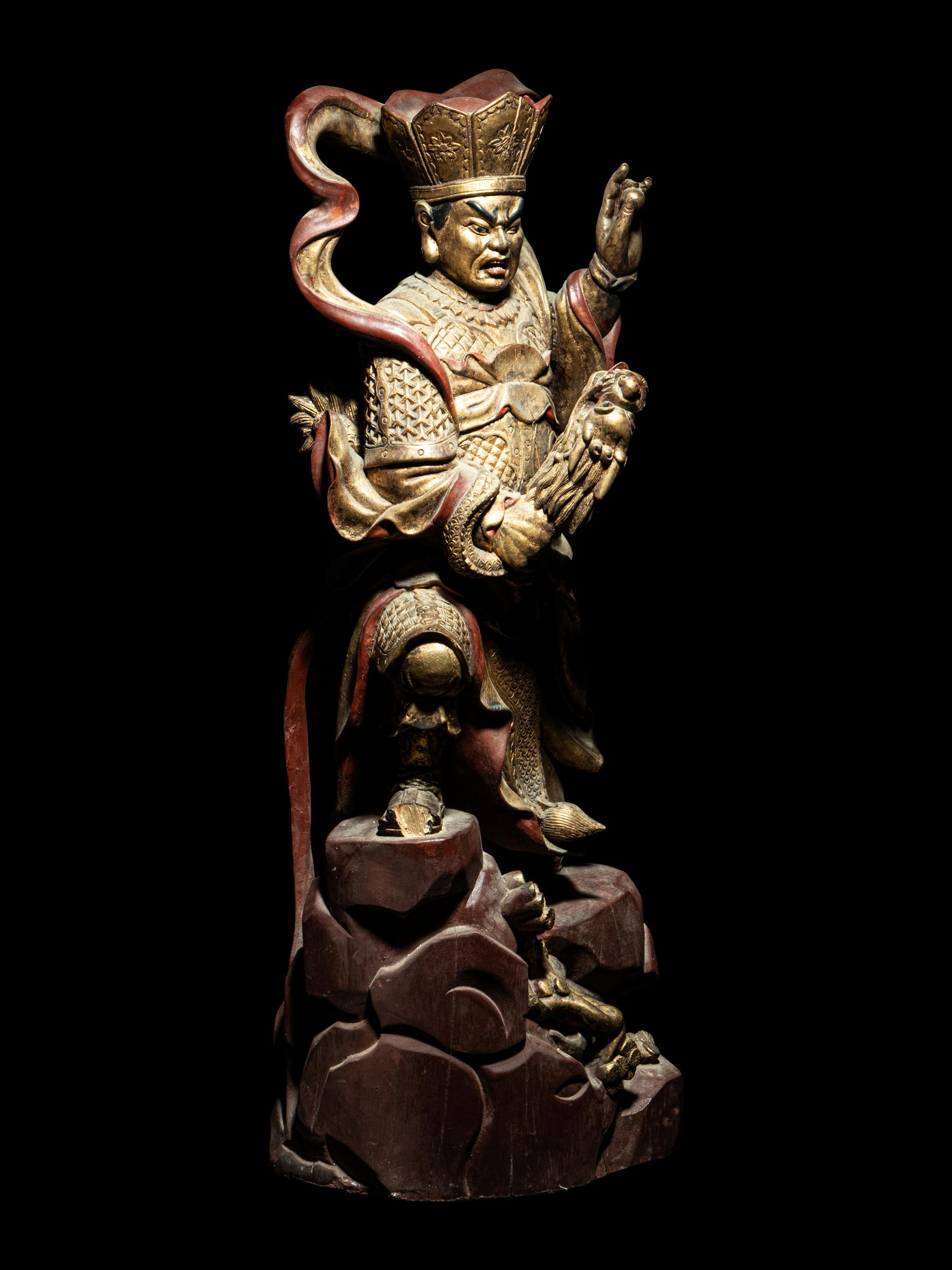 A Set of Four Gilt and Red Lacquered Wood Figures of Guardians