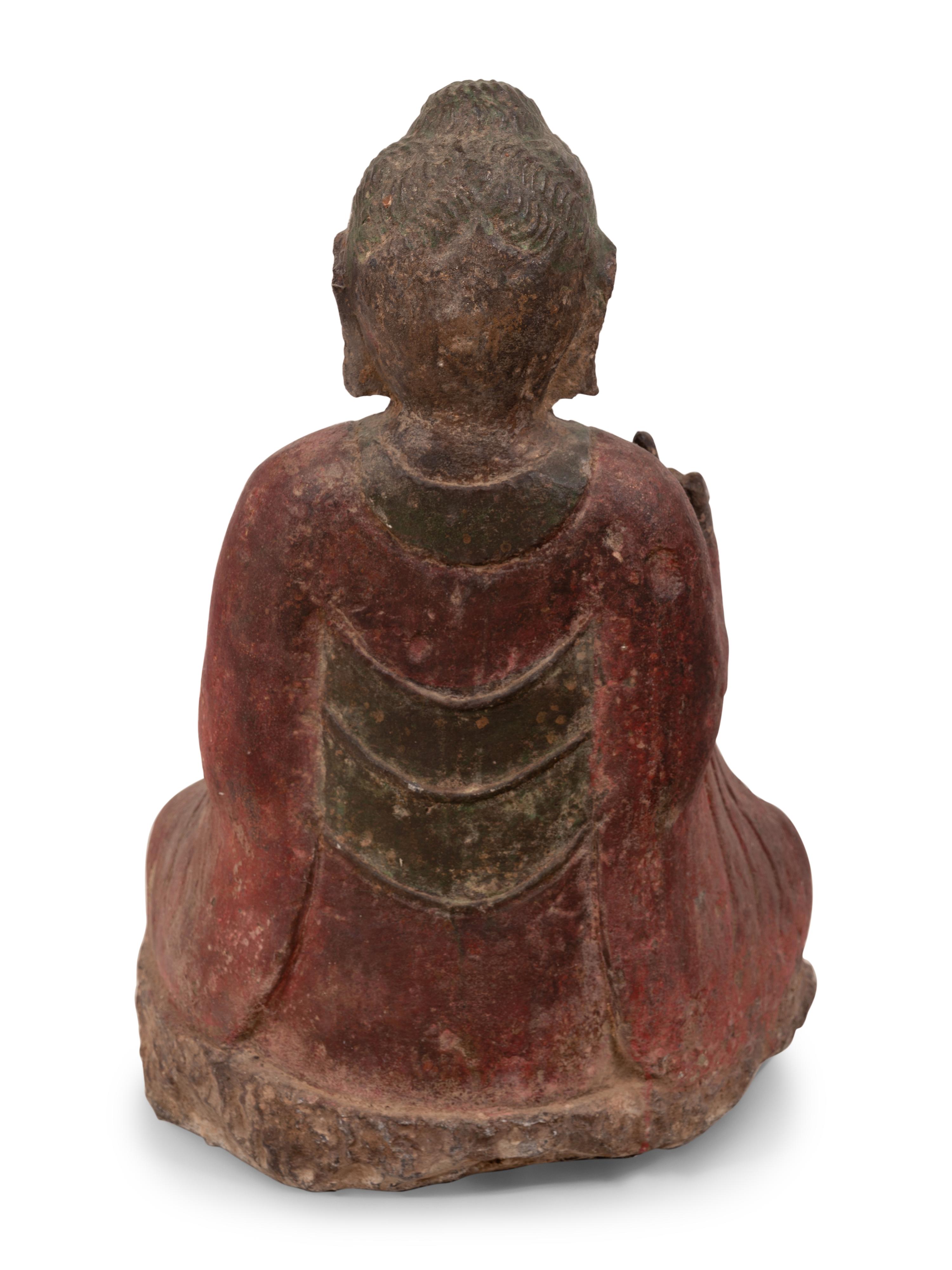 A Chinese Carved Stone Seated Buddha with Polychrome Decoration