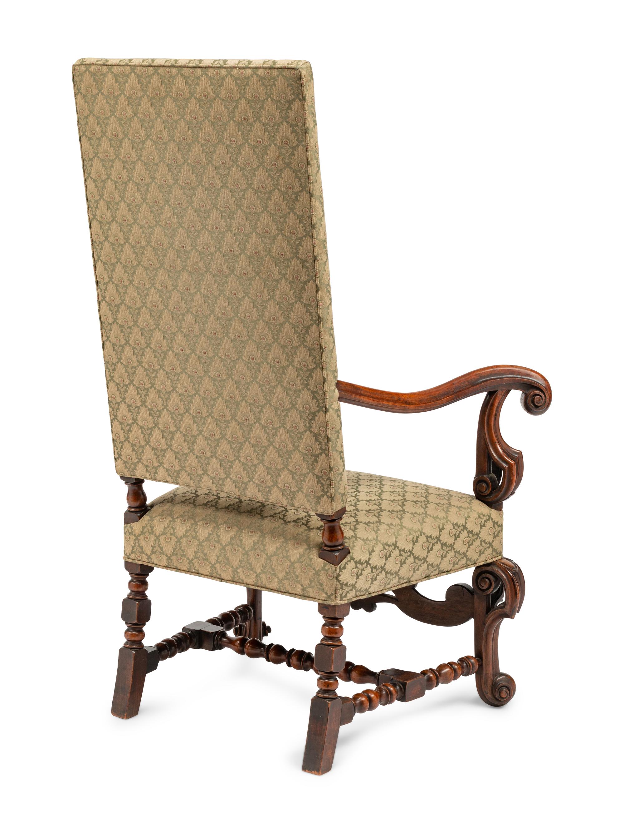 A Continental Baroque Style Carved Walnut Armchair