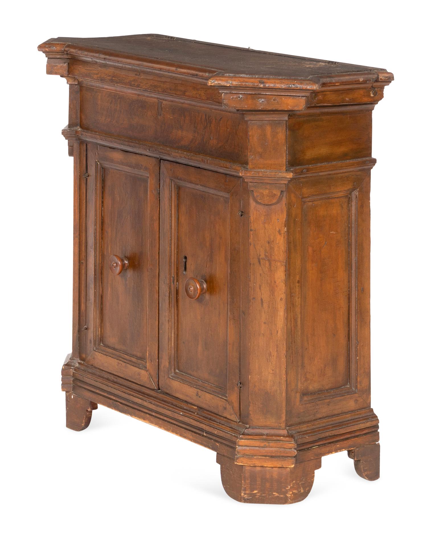 An Italian Baroque Walnut Cabinet