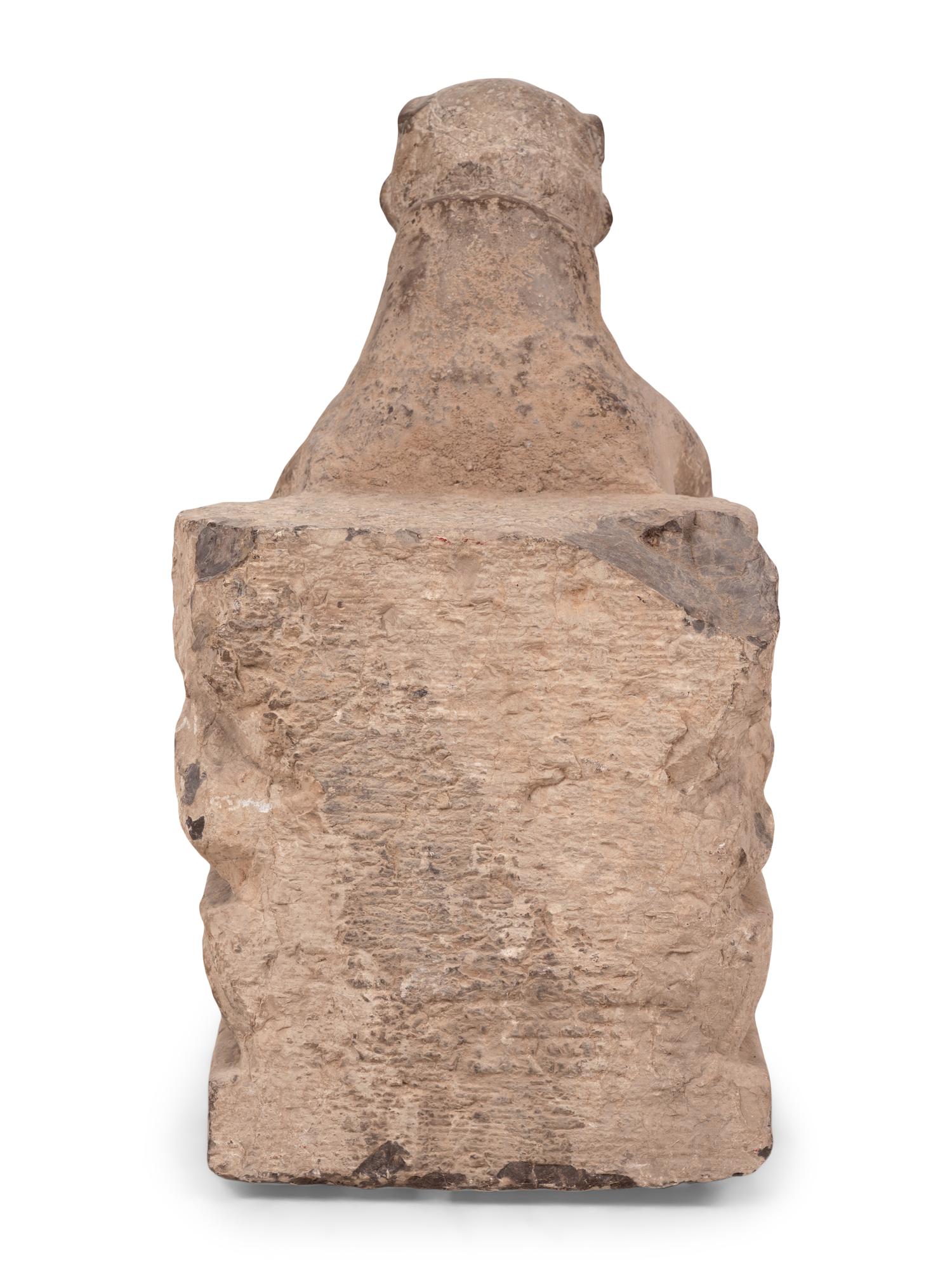 An Asian Carved Stone Seated Figure