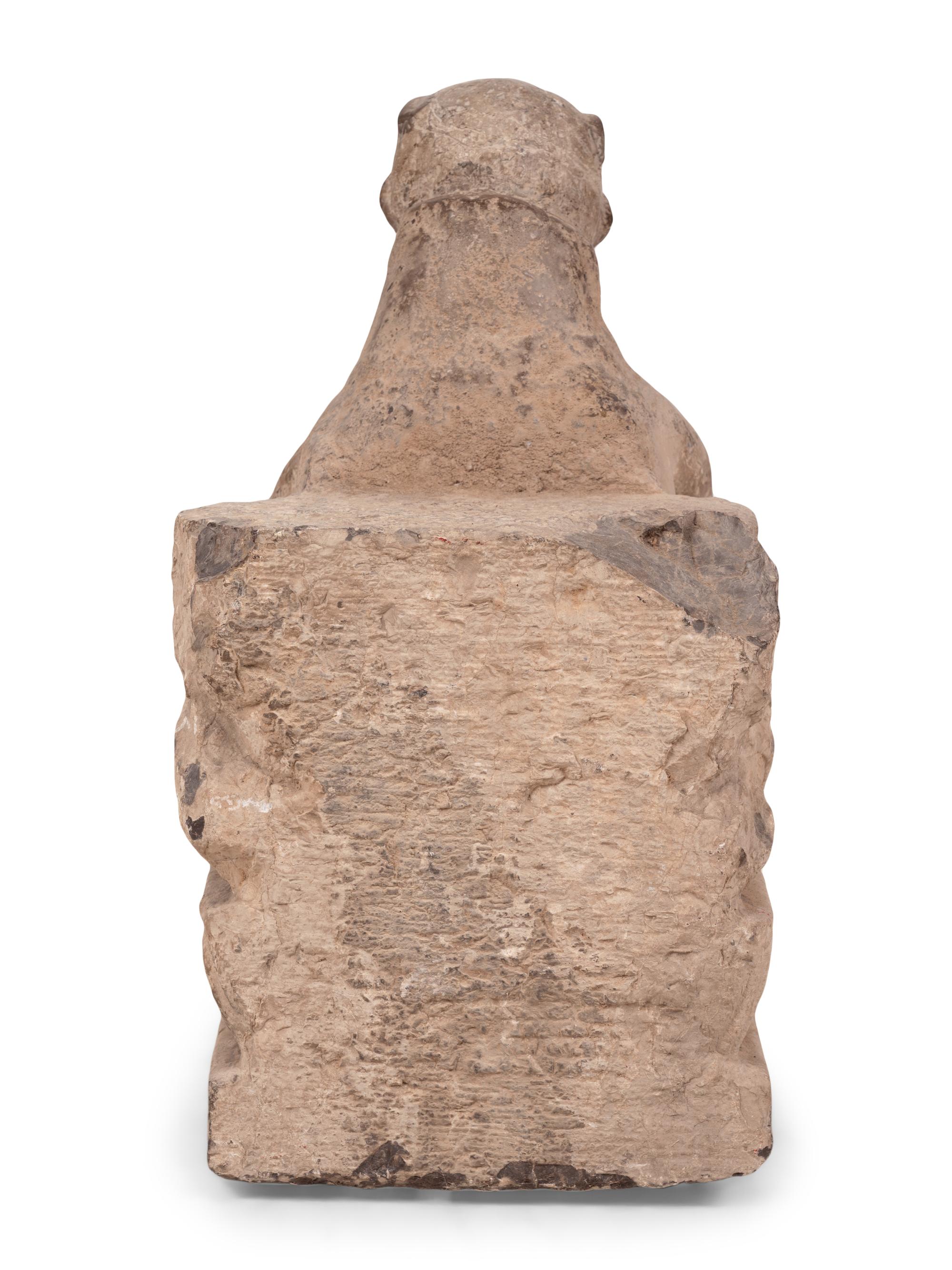 An Asian Carved Stone Seated Figure