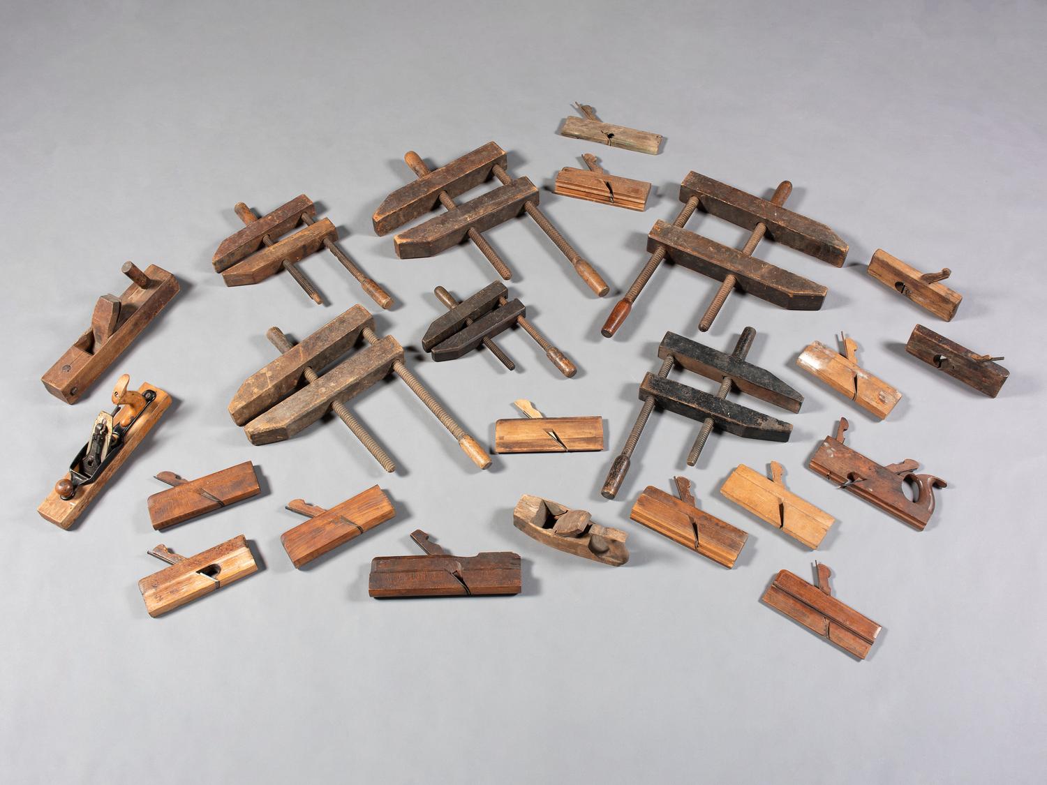 Twenty-Three Wooden Hand Planes and Clamps
