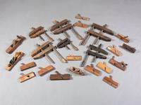 Twenty-Three Wooden Hand Planes and Clamps
