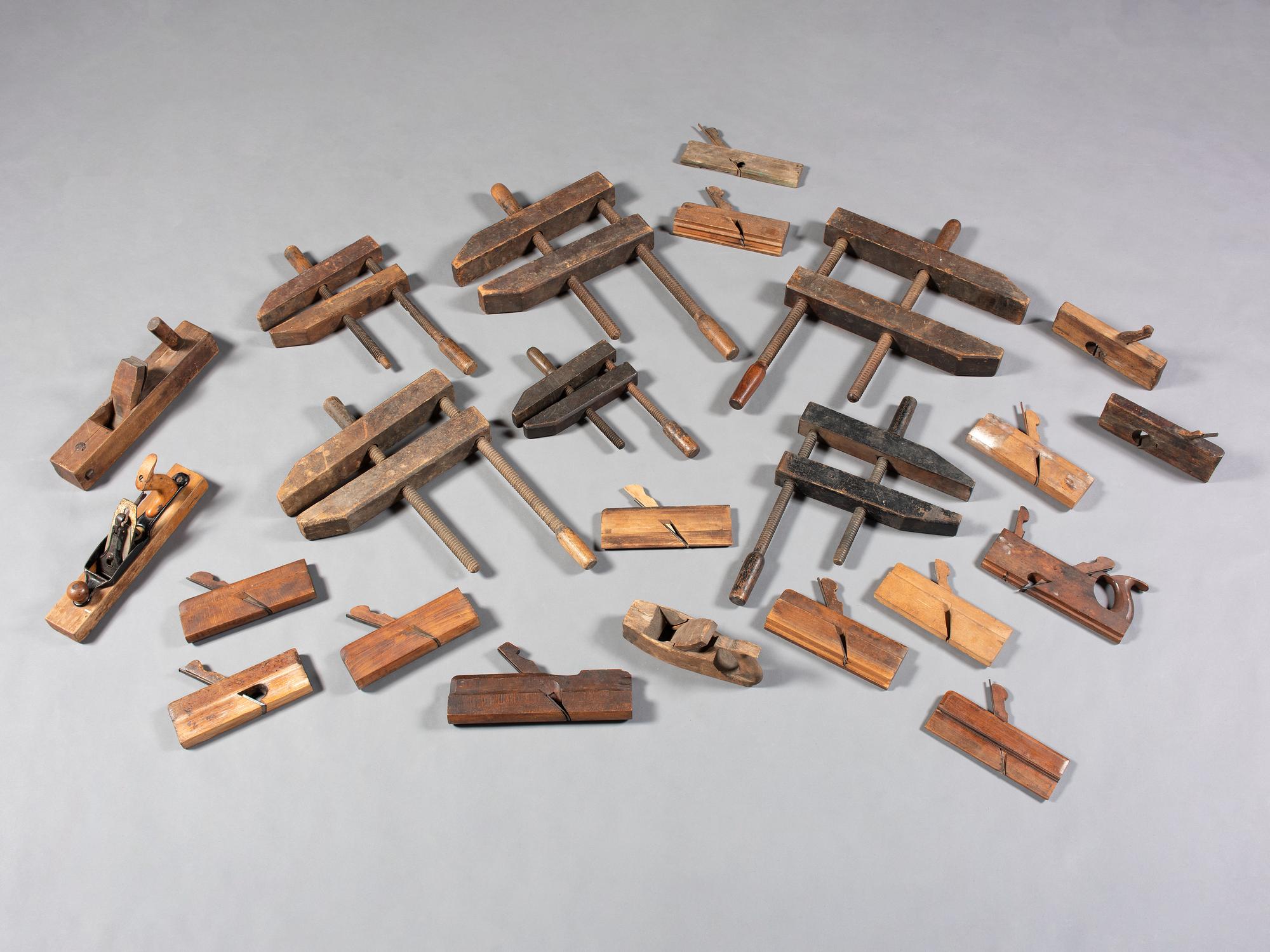 Twenty-Three Wooden Hand Planes and Clamps