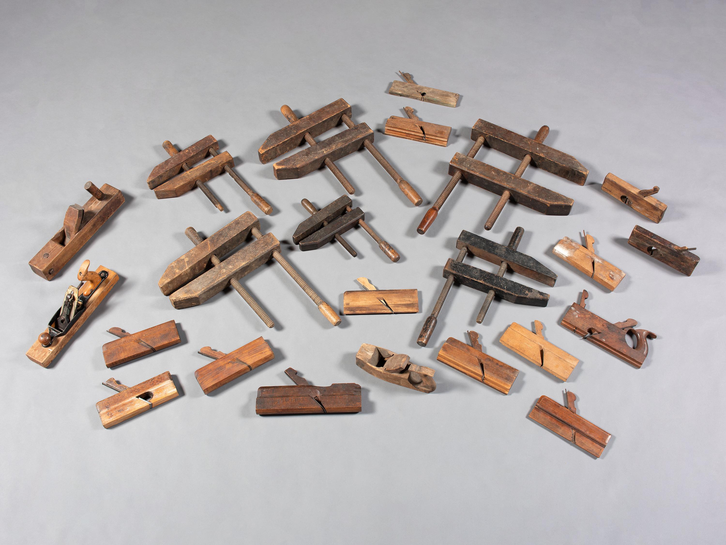 Twenty-Three Wooden Hand Planes and Clamps