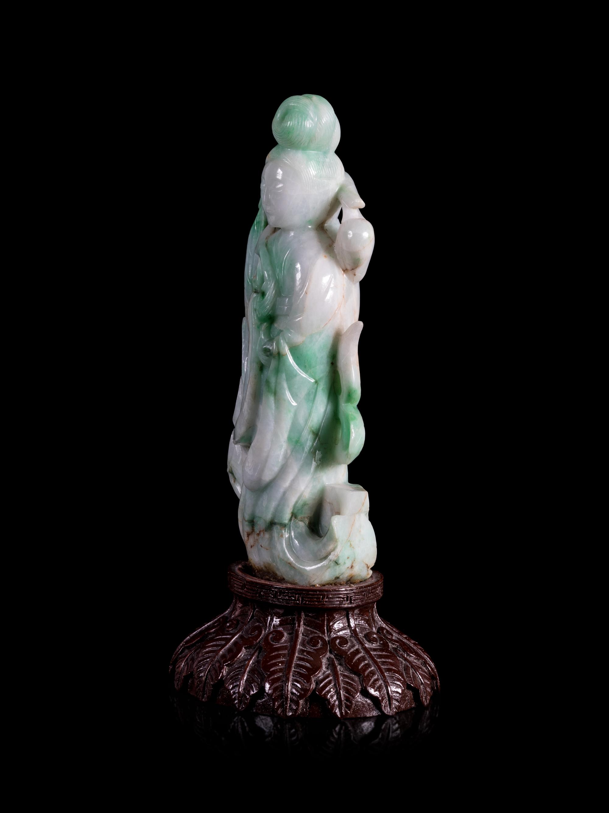 An Apple Green and White Jadeite Figure of a Lady Immortal