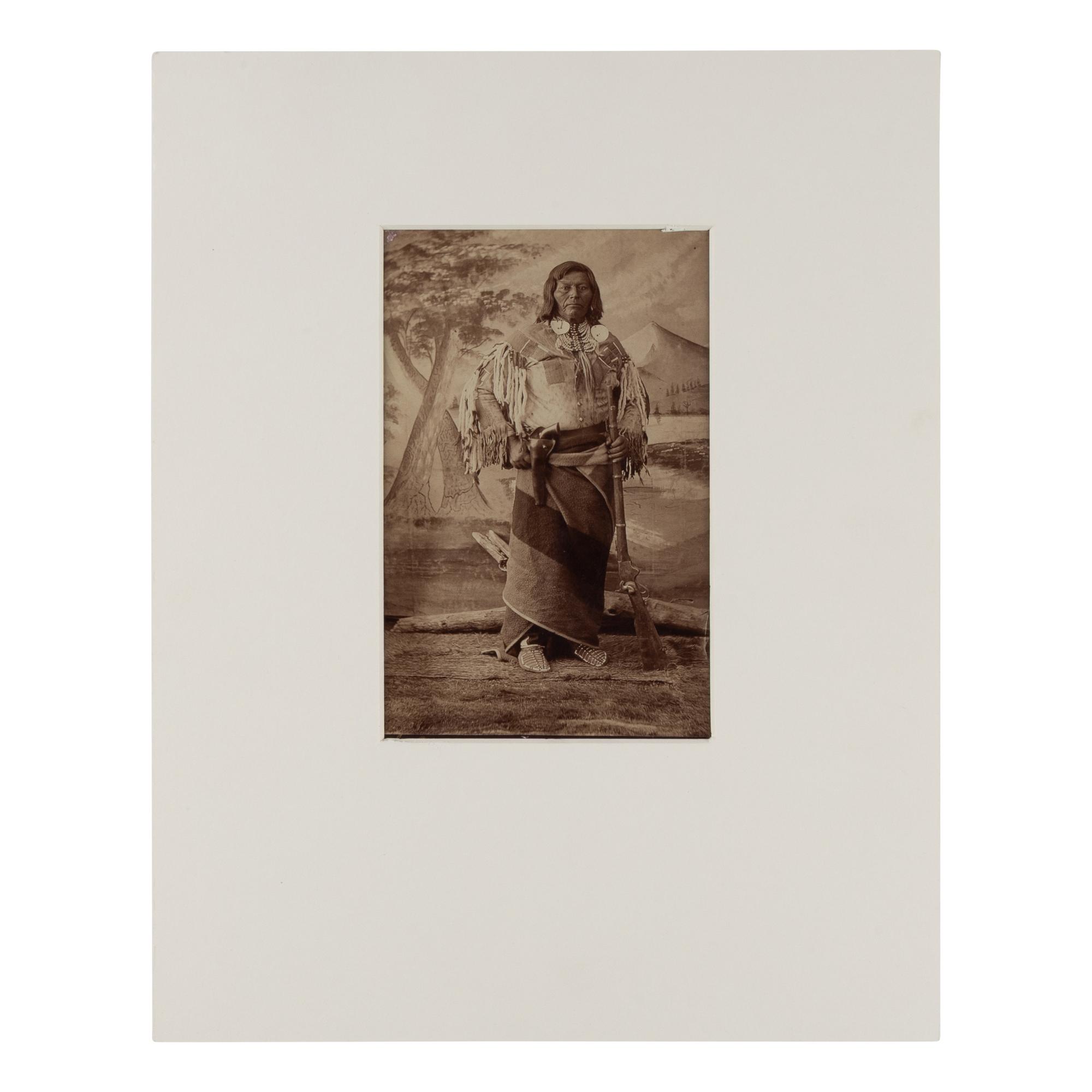 H.B. Calfee (American, 1847-1912) — Studio Portrait of a Double-Armed Native American Leader