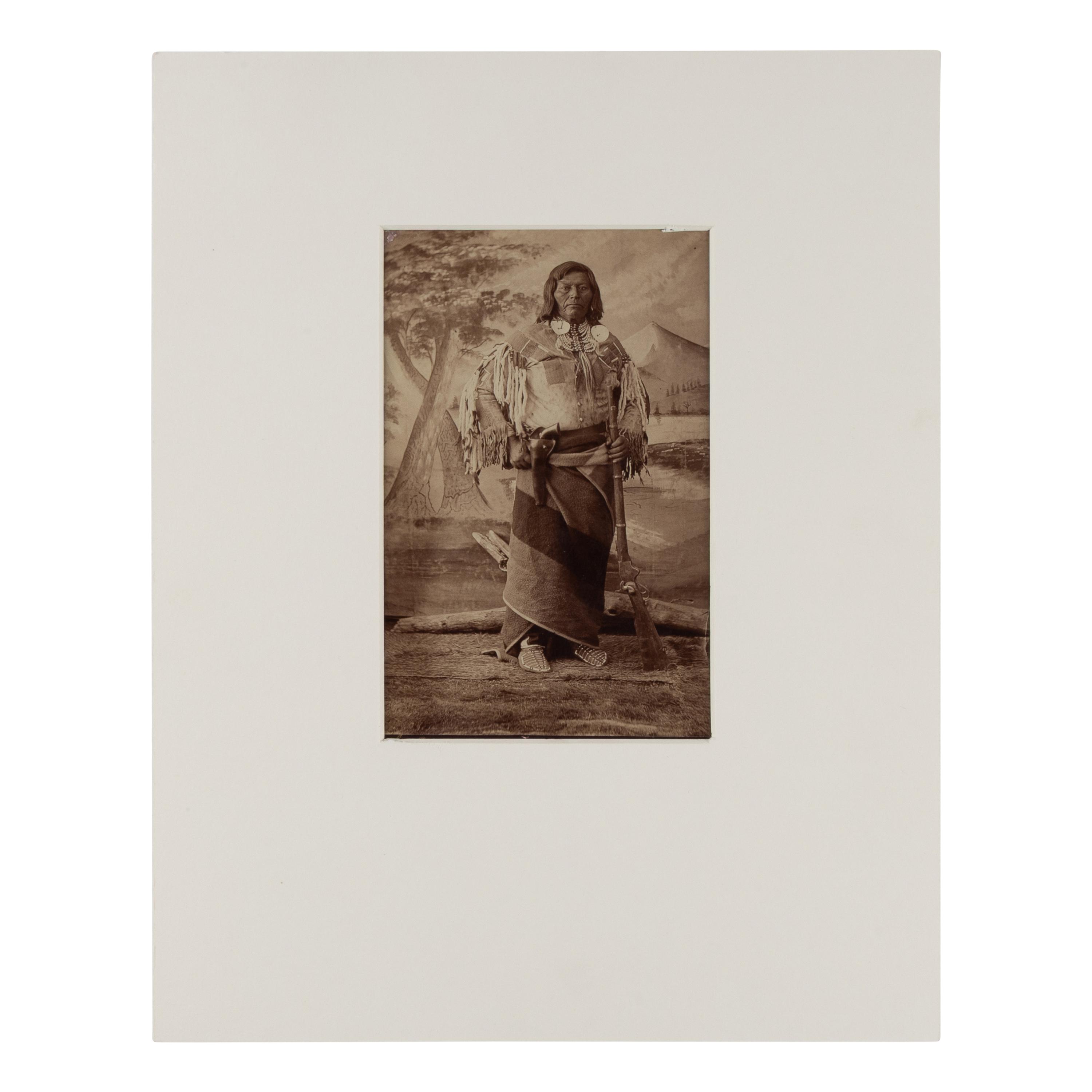 H.B. Calfee (American, 1847-1912) — Studio Portrait of a Double-Armed Native American Leader