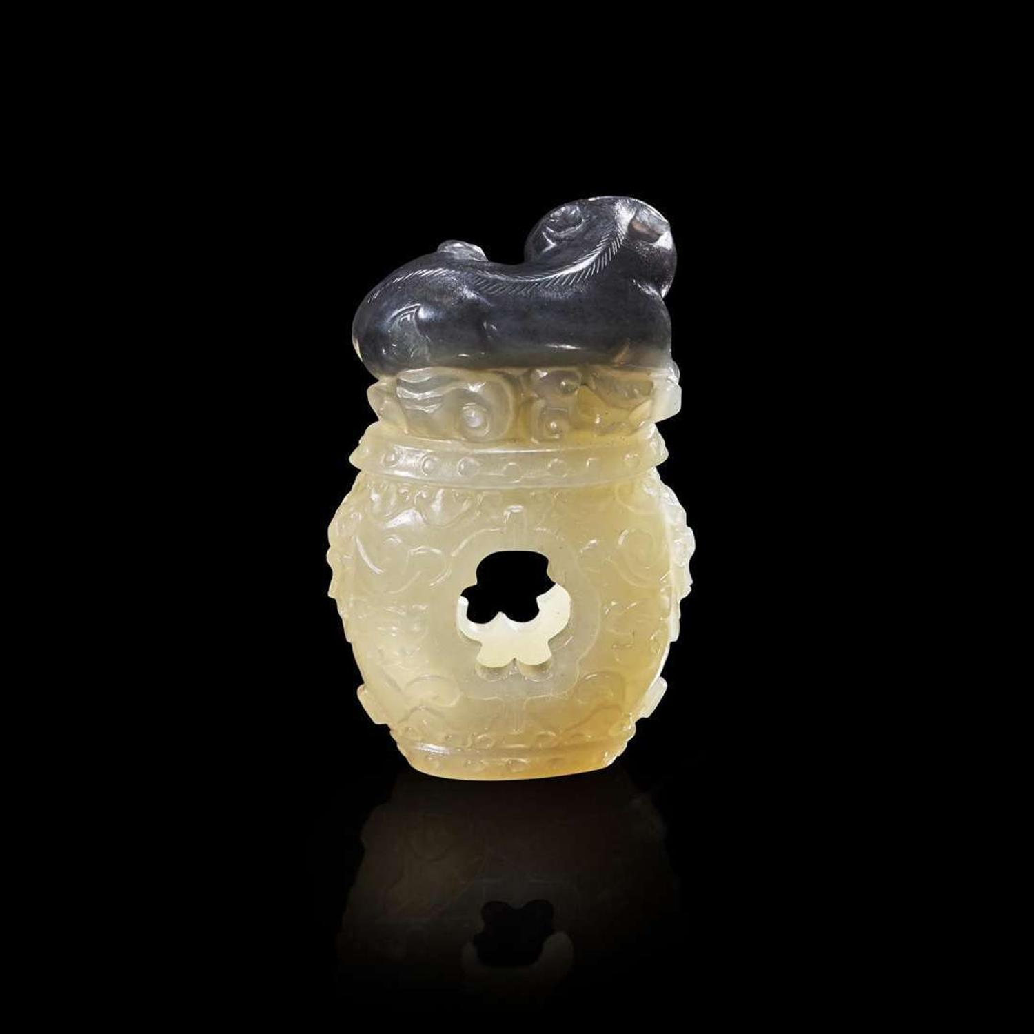A Chinese carved two-color jade "Cat and Butterfly on Garden Stool" toggle “貓蝶”俏色玉雕一件