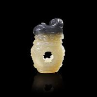 A Chinese carved two-color jade "Cat and Butterfly on Garden Stool" toggle “貓蝶”俏色玉雕一件