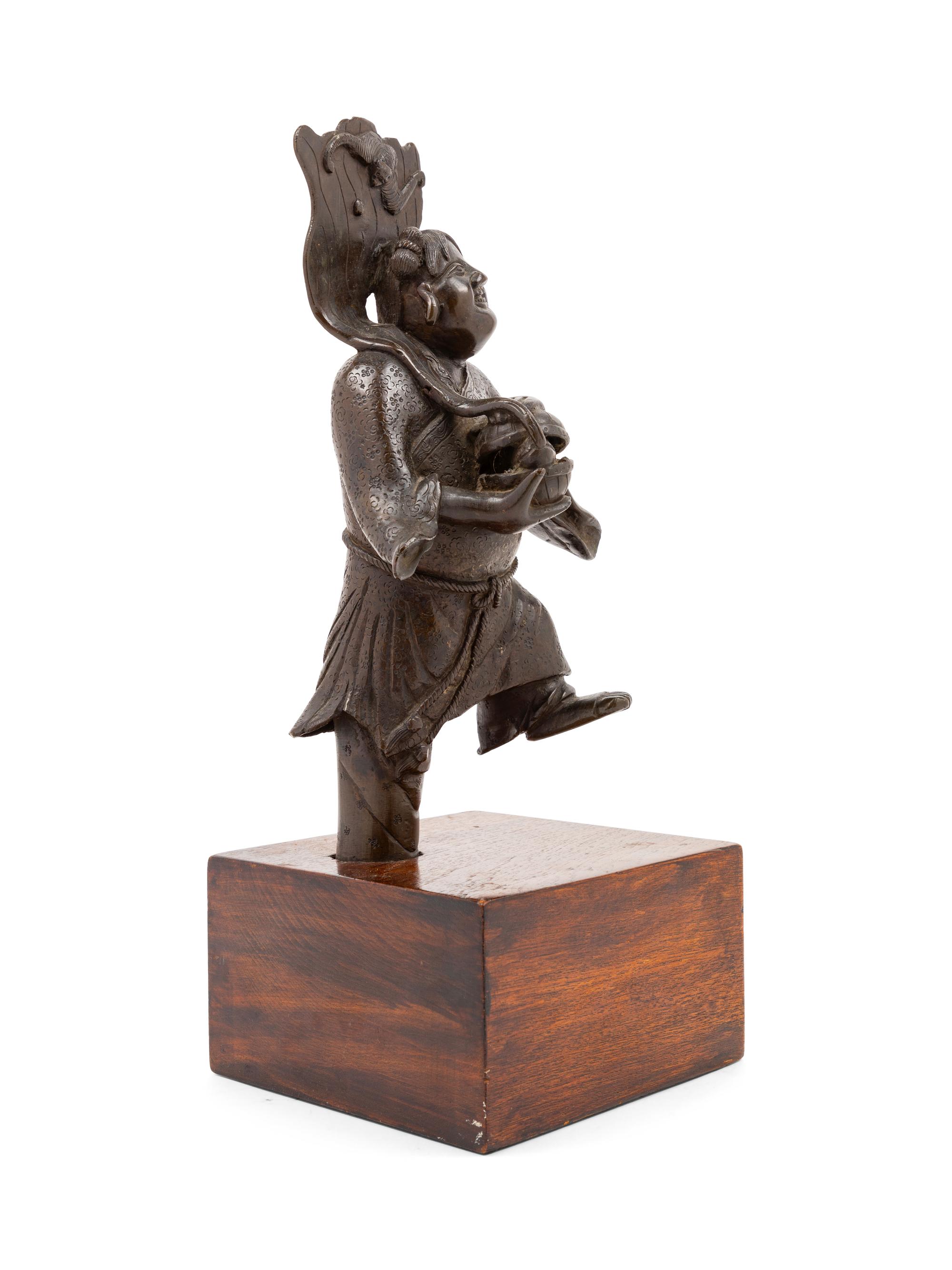 A Chinese Bronze Figural Group of Hehe Er'xian