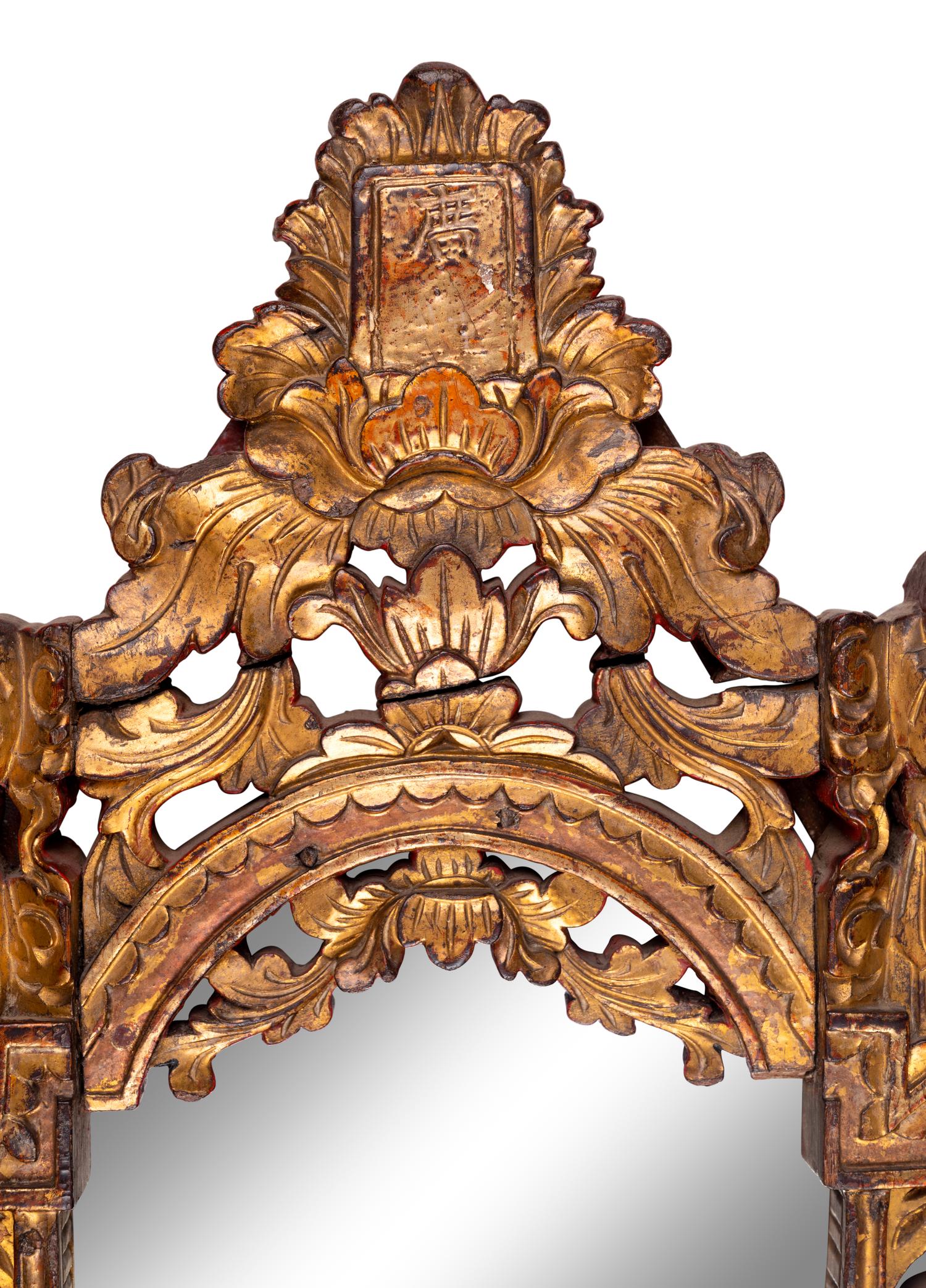 A Chinese Red and Gilt Lacquered Carved Wood Mirror