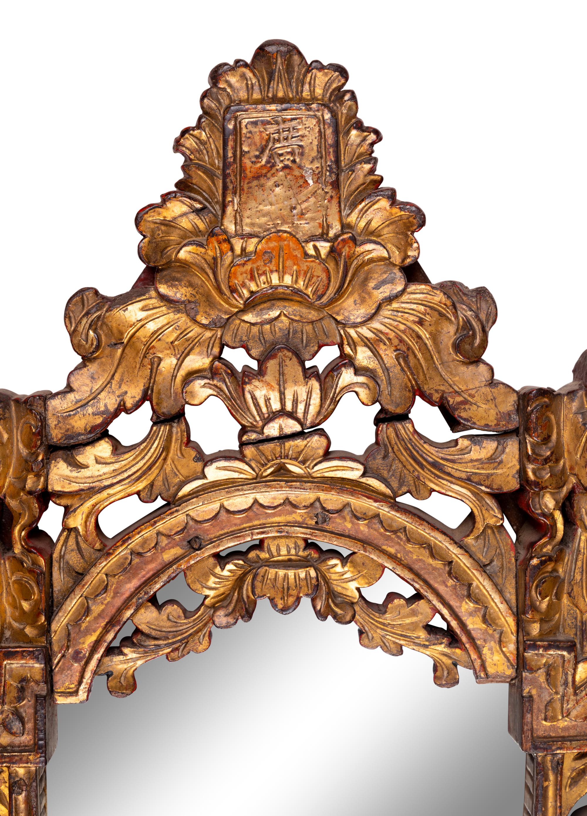 A Chinese Red and Gilt Lacquered Carved Wood Mirror