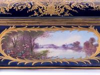 A Sèvres Style Painted and Parcel Gilt Porcelain Table Casket