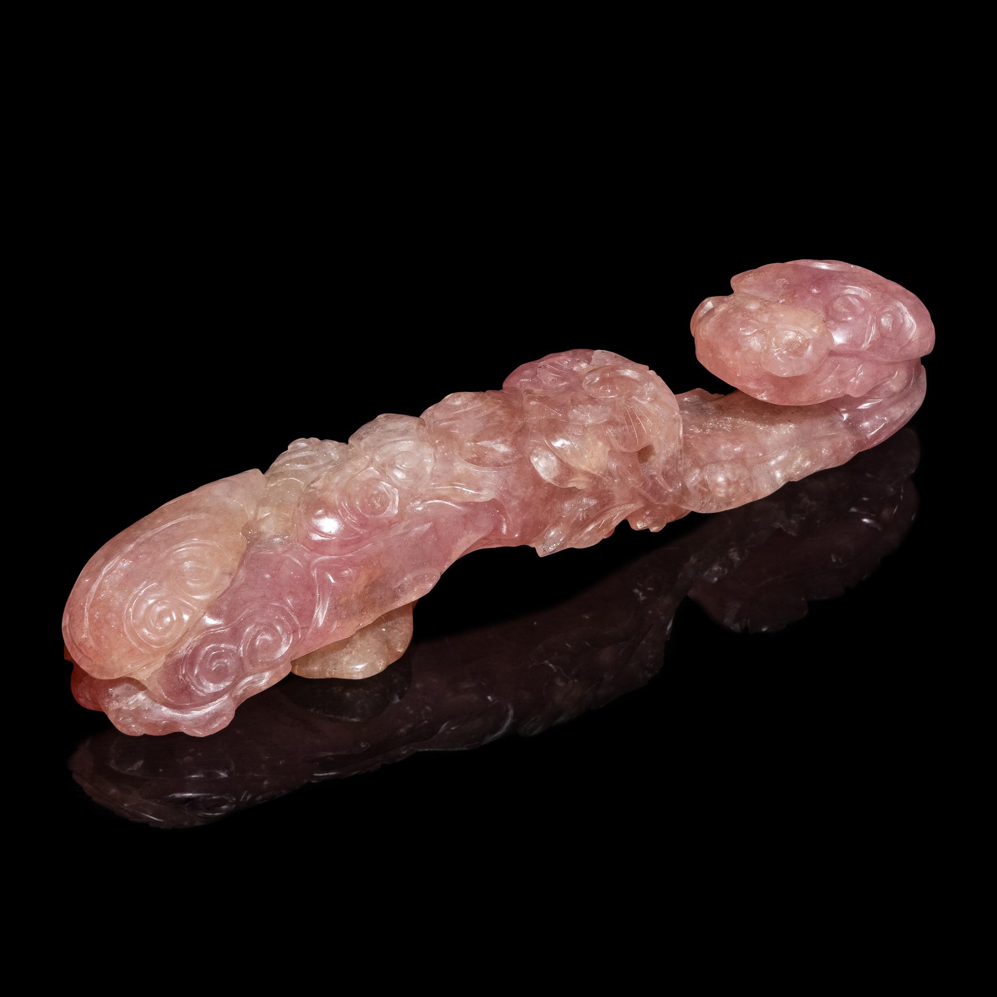 A Chinese Pink Tourmaline 'Dragon and Lingzhi' Belt Hook, 19th Century — 清晚期 碧璽螭龍帶鈎