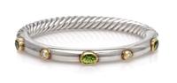 A Sterling Silver, 18 Karat Yellow Gold, Peridot and Diamond 'Cable' Bangle Bracelet, David Yurman, 15.00 dwts.