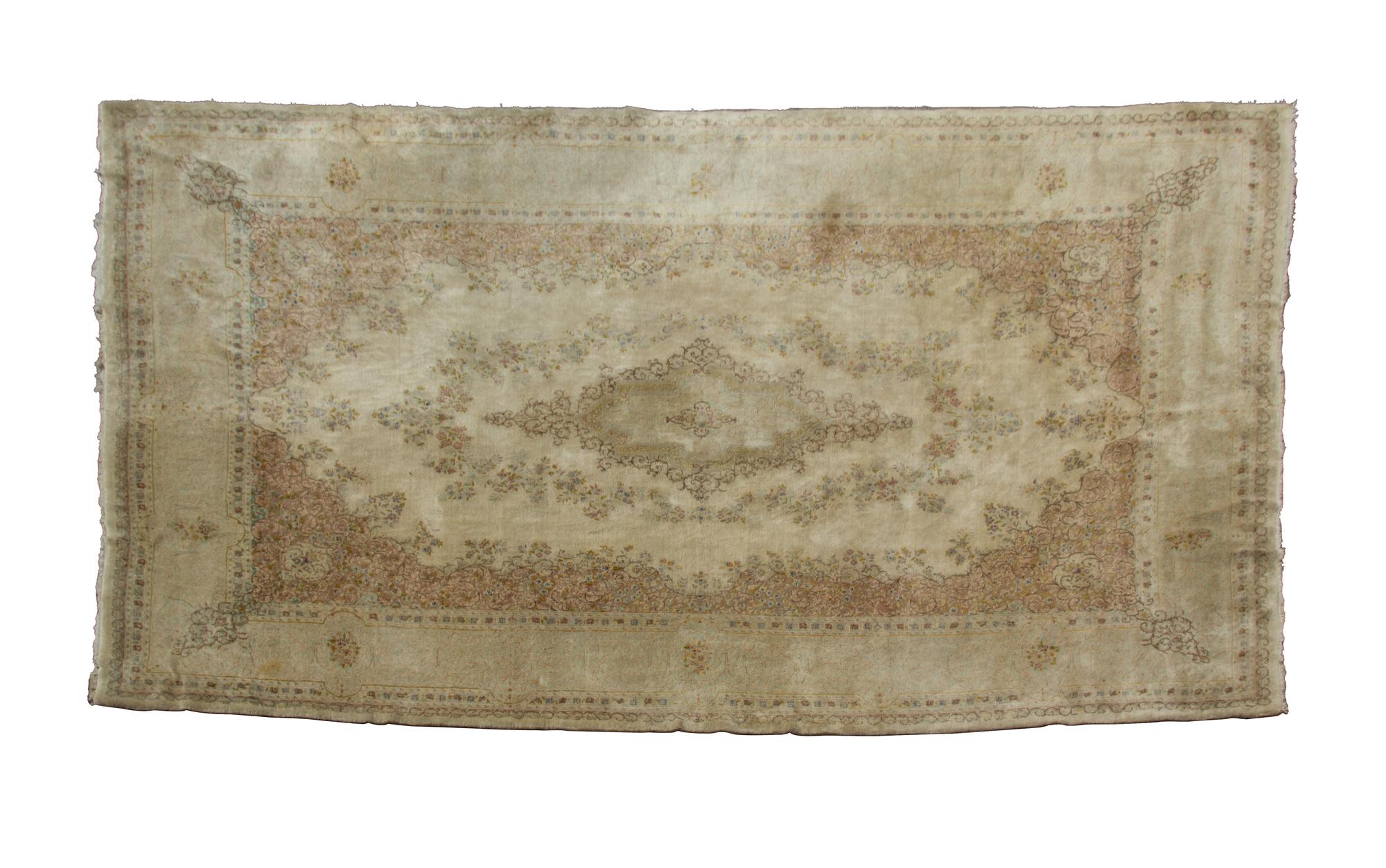 A Kerman Wool Rug 19 feet 5/8 inches x 11 feet 7 inches.