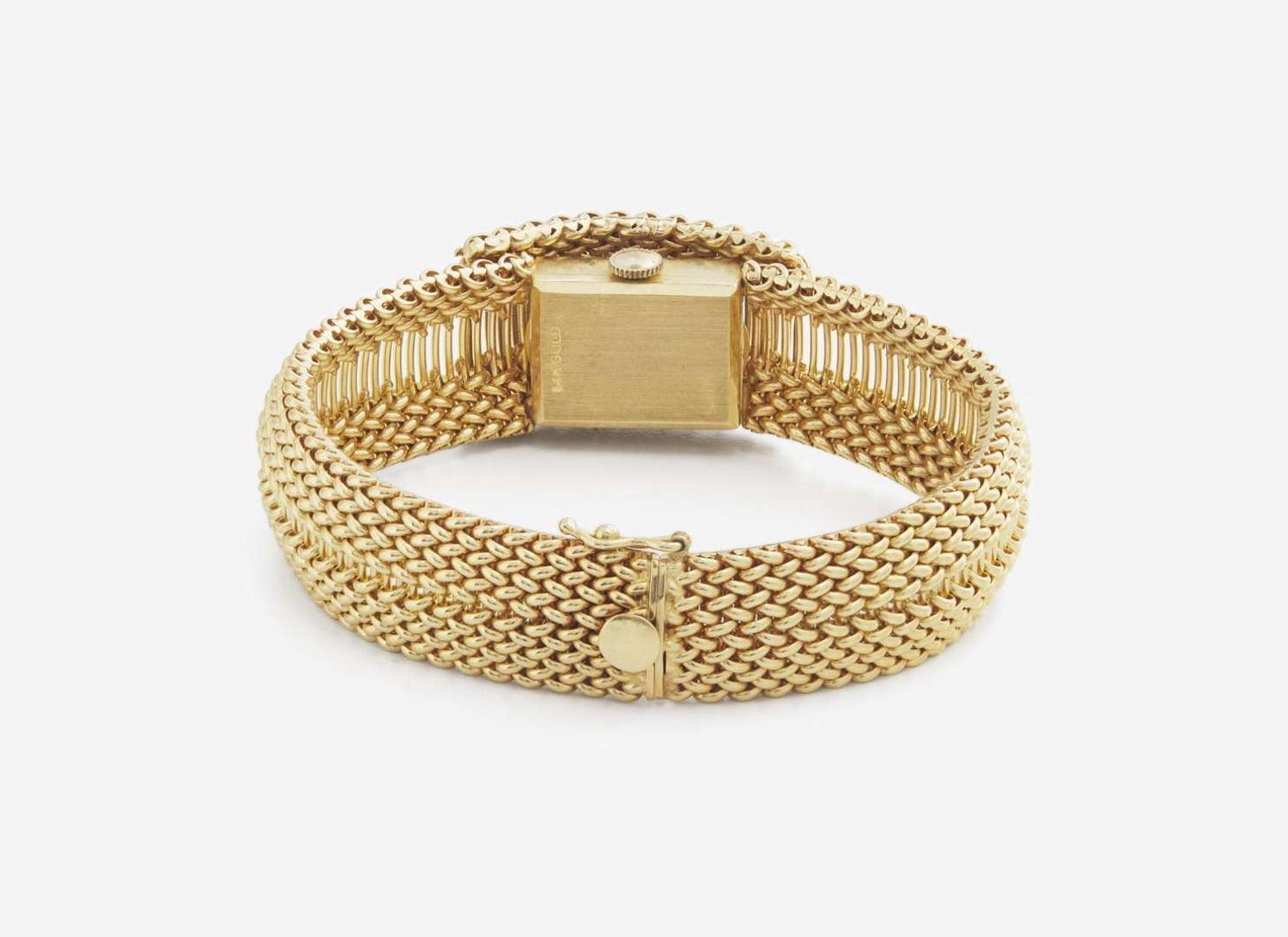 A Ladies 14K Yellow Gold Hidden Dial Watch