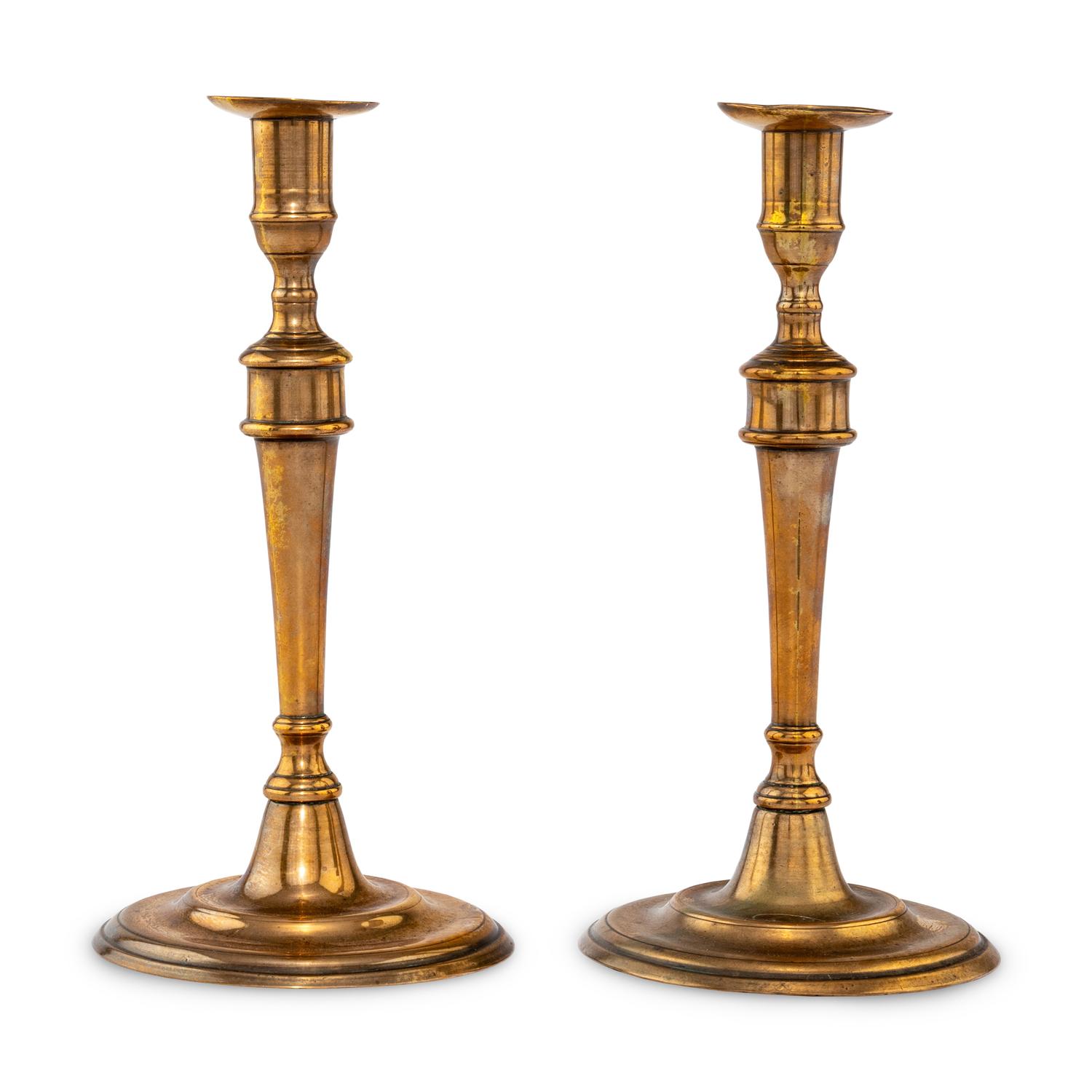 A Pair of George III Bell Metal Candlesticks